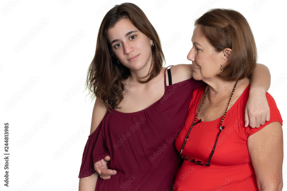 Hispanic teenage girl hugging her grandmother - Isolated on white Hispanic teenage girl hugging her grandmother - Isolated on white
