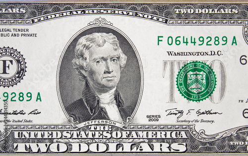 President Thomas Jefferson on US 2 dollar bill close up, Unites States federal fed reserve note.. photo