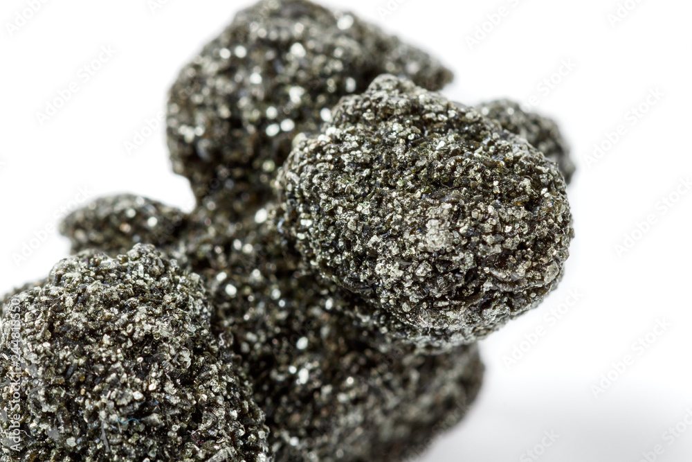 Macro mineral stone chlorite in quartz on a white background Macro mineral stone chlorite in quartz on a white background