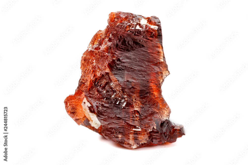 Macro mineral stone Garnet Spessartine on a white background Macro mineral stone Garnet Spessartine on a white background