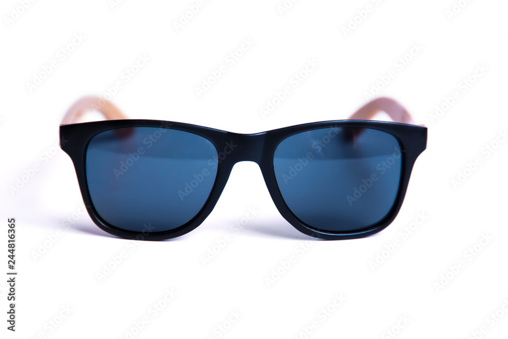 Stylish black sunglasses with wooden frames isolated on white background