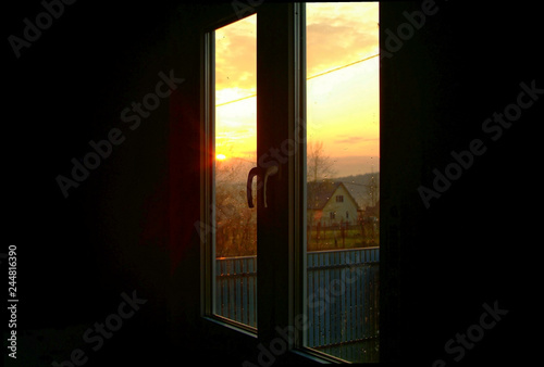 sunset through the Windows in a wooden house