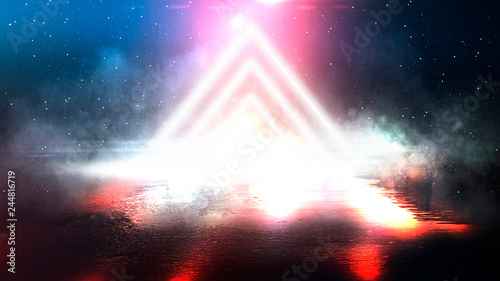 Fototapeta Naklejka Na Ścianę i Meble -  Light pyramid triangle. Neon triangle in the center, light, rays, smoke. Abstract background with rays and neon.