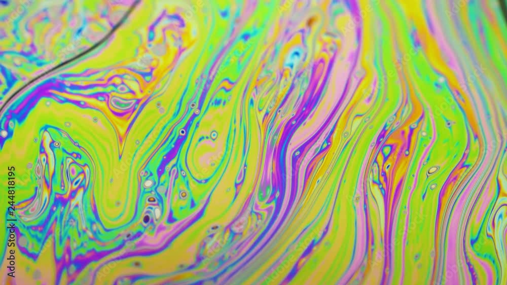 Psychedelic background of motion surface of colorful soap bubble Psychedelic background of motion surface of colorful soap bubble