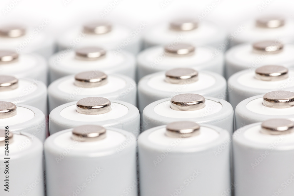 AA batteries are close to each other. Close-up of white batteries on a white background. Battery technology