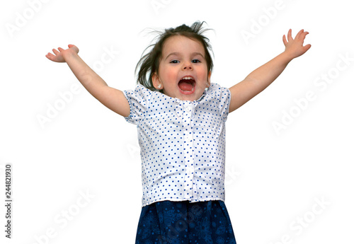 funny little smiling girl jumps and shows fingers. Studio shot on white background
