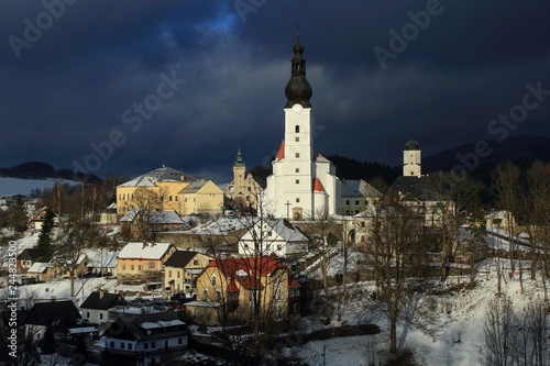 Winter view of the town of Branna, a small town with beautiful renaissance church and castle in the Jeseniky mountains, Czech Republic.
