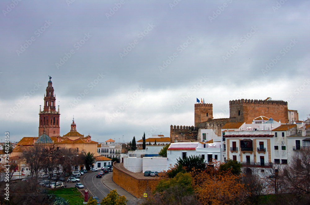 View of the ancient castle and church, cloudy day View of the ancient castle and church, cloudy day