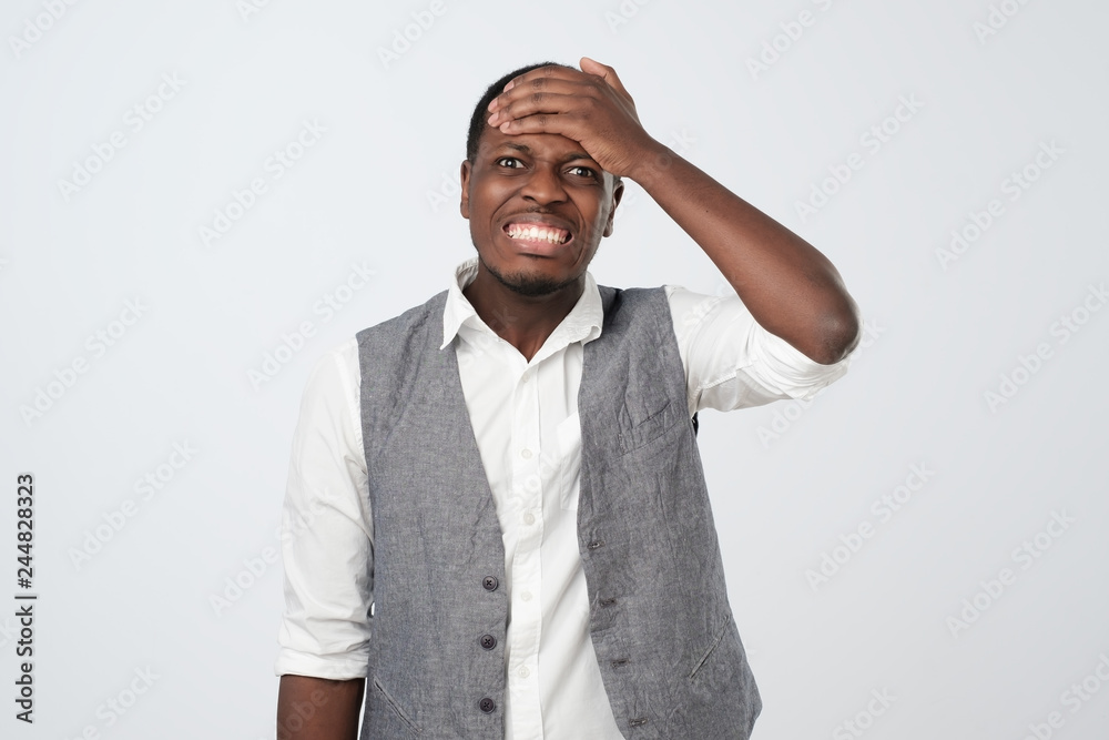 African man remembering funny men laughing out loud from joy and happiness holding hands on head Stock Photo | Adobe Stock African man remembering funny men laughing out loud from joy and happiness holding hands on head Stock Photo | Adobe Stock