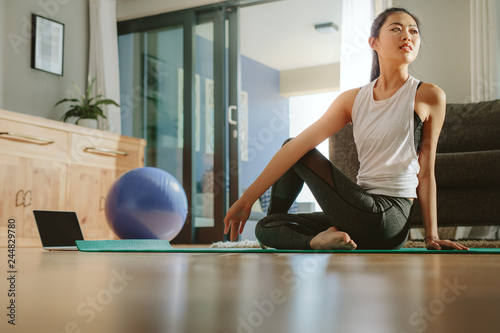 Asian woman practicing yoga for good health photo
