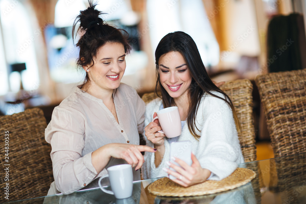 Friends drinking coffee at home Friends drinking coffee at home