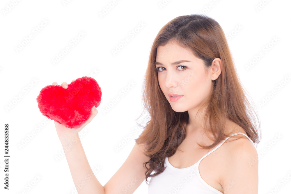 Portrait of beautiful asian young woman holding red heart shape pillow and smile isolated on white background, valentines day, holiday concept. Portrait of beautiful asian young woman holding red heart shape pillow and smile isolated on white background, valentines day, holiday concept.