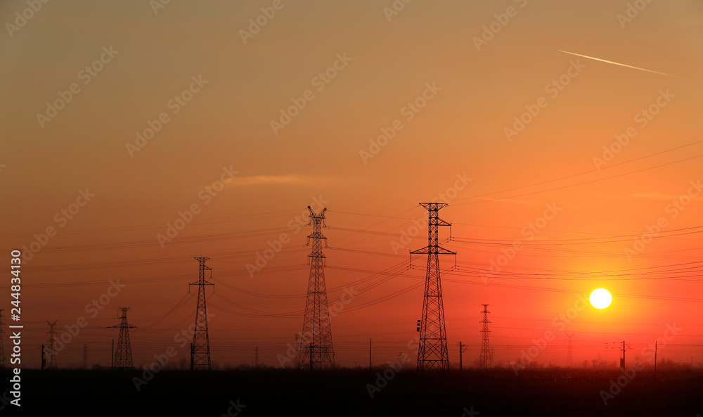 Fototapeta premium High piezoelectric towers, in the setting sun