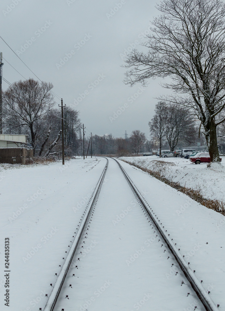 Snow-covered railway stretching into the distance and perspective on a winter day Snow-covered railway stretching into the distance and perspective on a winter day