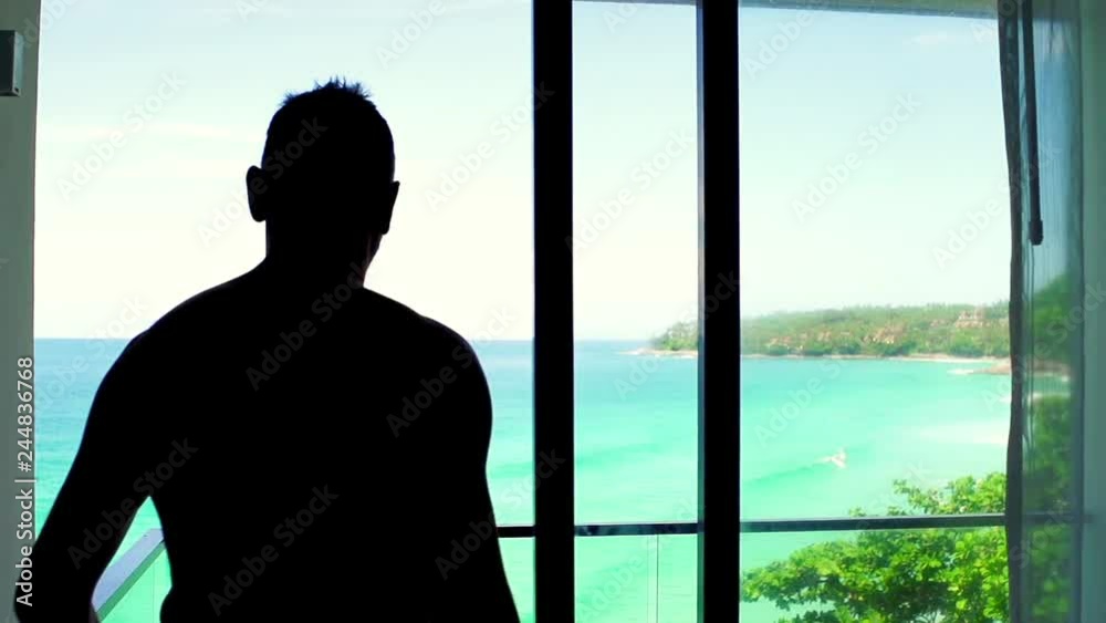 Young man in towel stretching his arms on terrace with sea view, super slow motion
Young man in towel stretching his arms on terrace with sea view, super slow motion