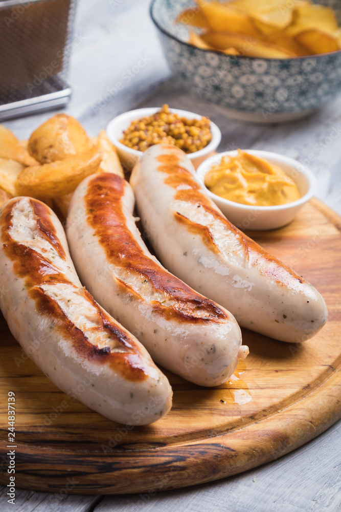 German sausages with mostard and fried potato German sausages with mostard and fried potato