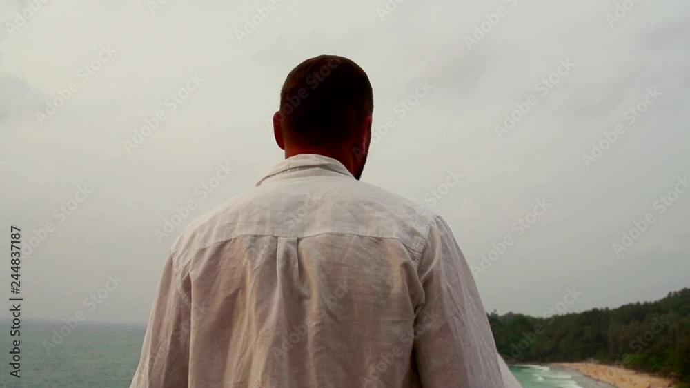 Young man walking on the beach, super slow motion
Young man walking on the beach, super slow motion