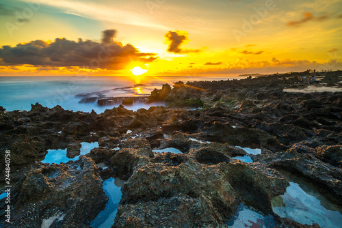 Fototapeta Rock with sunset background.
