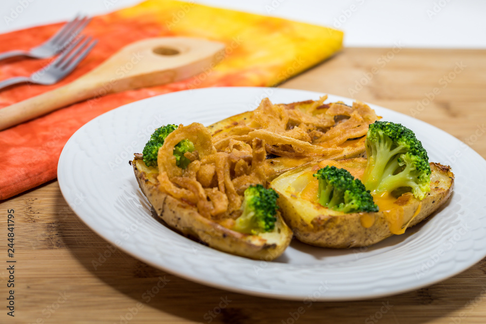Potato Skins appetizer with broccoli, cheddar cheese and fried onions Potato Skins appetizer with broccoli, cheddar cheese and fried onions