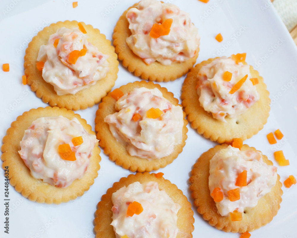Tasty crackers with cream cheese,carrot.Healthy snacks, on dish Tasty crackers with cream cheese,carrot.Healthy snacks, on dish