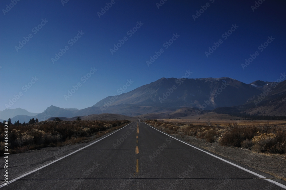 Empty road with mountains on the horizon.