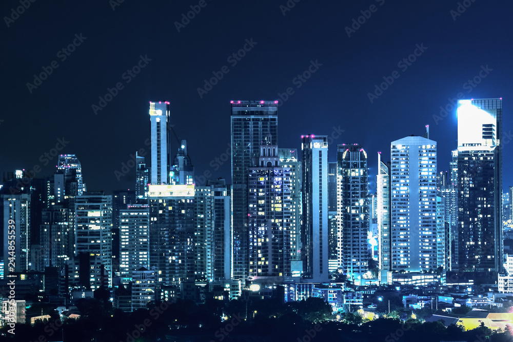 landscape scenery of buildings and skycrapers in the central business area of Bangkok city at night