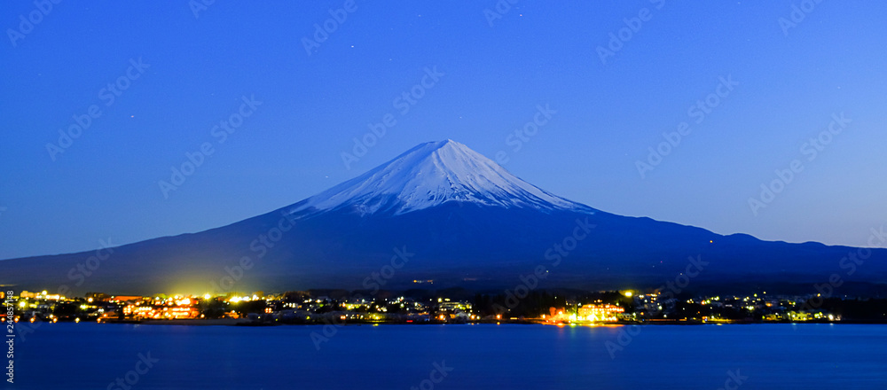 Panorama of Fuji mountain with snow capped in the night at Lake kawaguchiko, Yamanashi, Japan. landmark and popular for tourist attractions