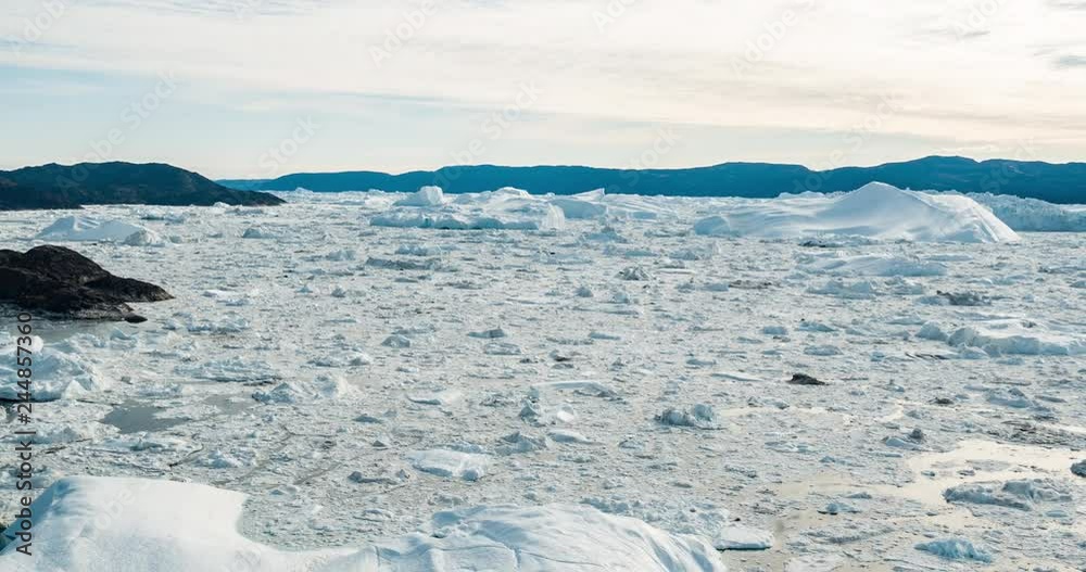 Aerial drone video of Iceberg and ice from glacier in arctic nature landscape on Greenland. Aerial video drone photo of icebergs in Ilulissat icefjord. Affected by climate change and global warming. Aerial drone video of Iceberg and ice from glacier in arctic nature landscape on Greenland. Aerial video drone photo of icebergs in Ilulissat icefjord. Affected by climate change and global warming.