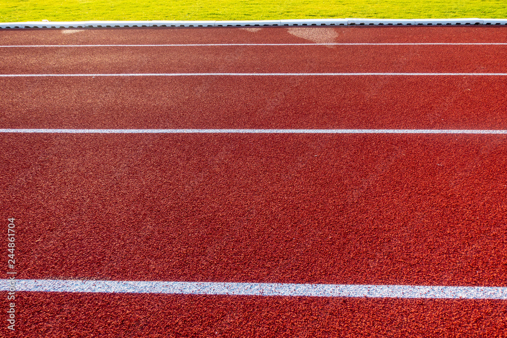 Fototapeta premium Red running track in stadium