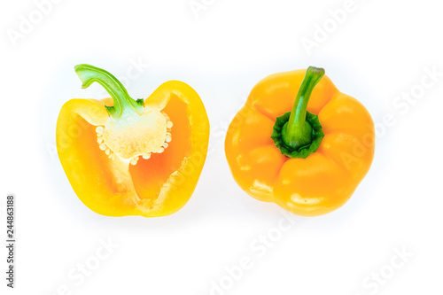 yellow bell pepper cut into pieces on white background  top view.