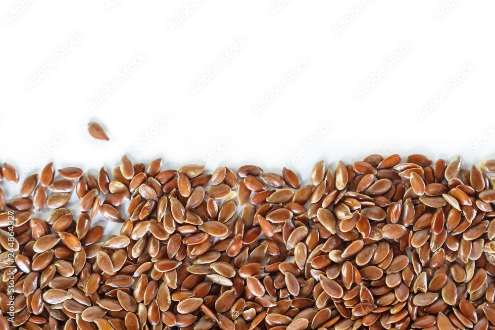 Brown flax seed on white background. - obrazy, fototapety, plakaty 