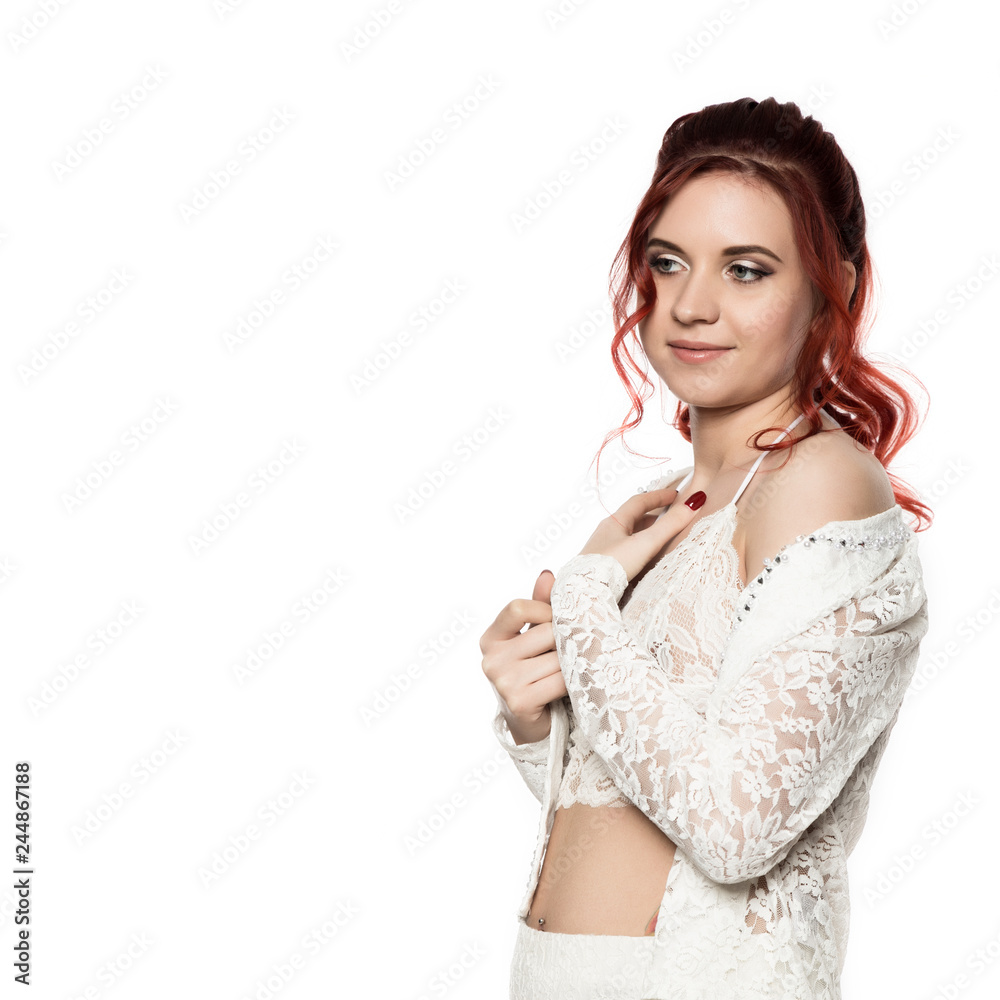 cheerful redhead girl in a transparent blouse with curly hair smiling on a white background. free space for your text cheerful redhead girl in a transparent blouse with curly hair smiling on a white background. free space for your text