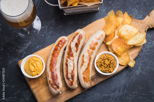 German sausages with mostard and fried potato photo