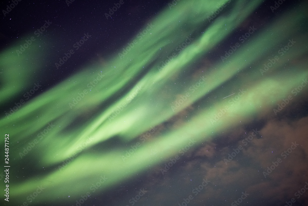Beautiful green Northern lights, Aurora borealis explosion with starry