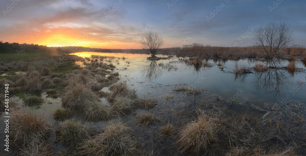 Spring nature landscape during the spring flood. Sunny morning w Spring nature landscape during the spring flood. Sunny morning w