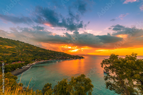 Colorful beautiful sunset in tropical Jemeluk bay on Amed, Bali, Indonesia