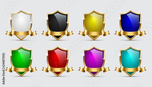 Set of color shields icons with golden frames and ribbons isolated on white background. Vector templates.
