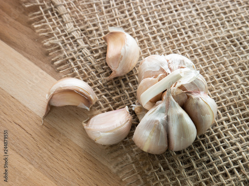 Fresh garlic,  rustic style, wooden background