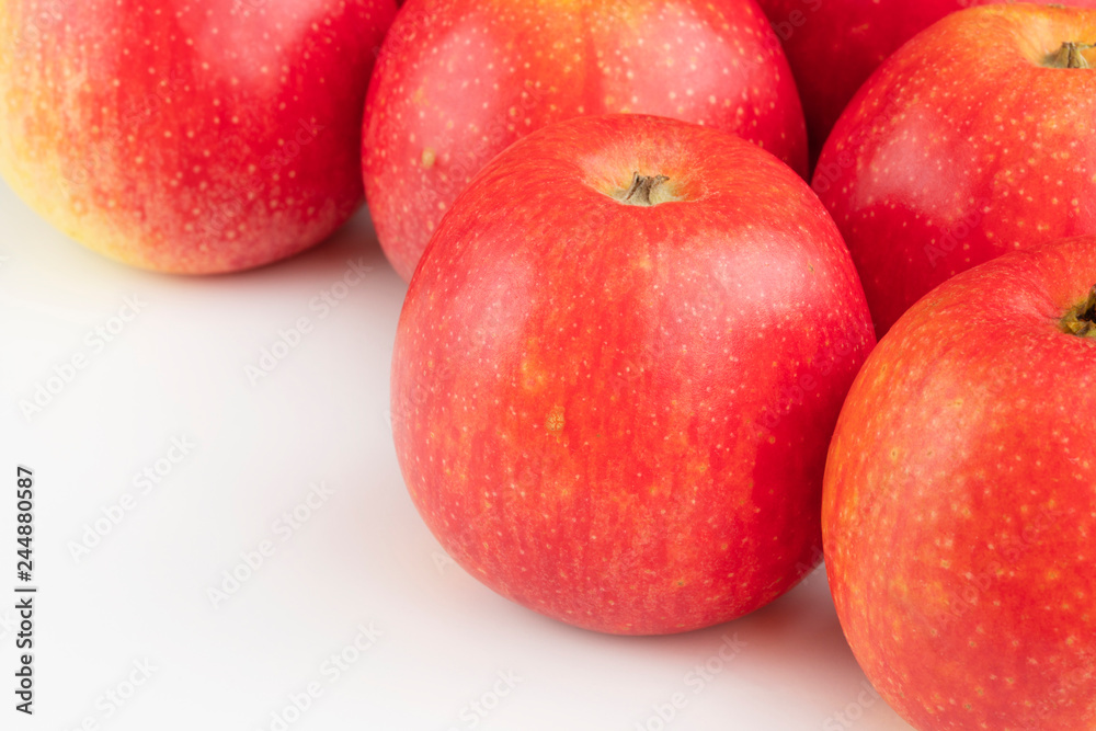 Red apples on the white table Red apples on the white table