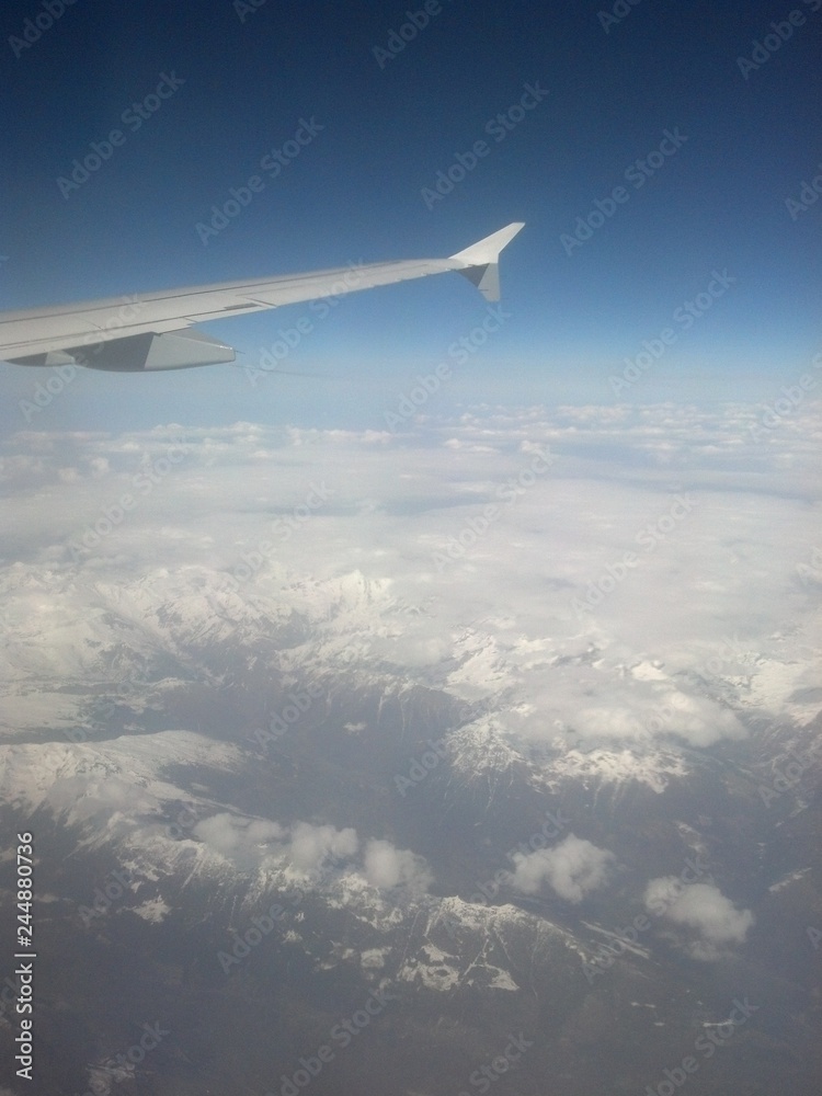 snowcapped mountains from the airplane snowcapped mountains from the airplane