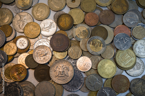 Collection of different coins background. Close up.