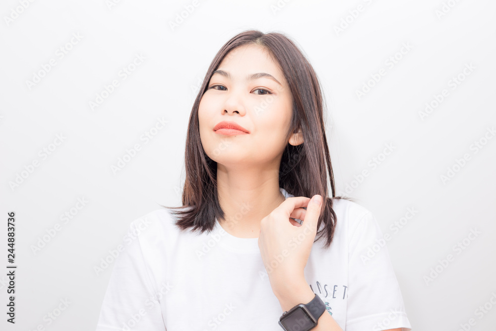 Smiling asian women with smart watch sitting on white background