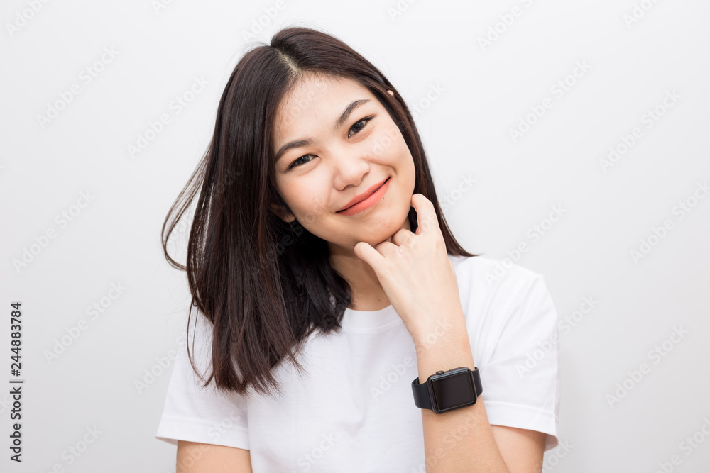 Smiling asian women with smart watch sitting on white background Smiling asian women with smart watch sitting on white background