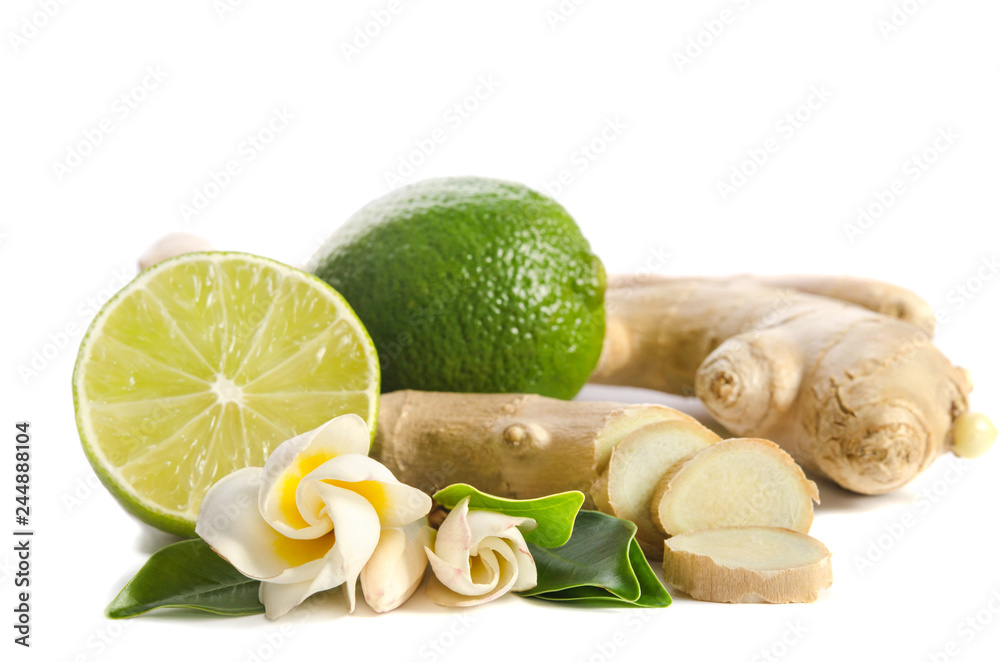 Ginger root and lime whole and half with flowers and leaves isolated on white background Ginger root and lime whole and half with flowers and leaves isolated on white background
