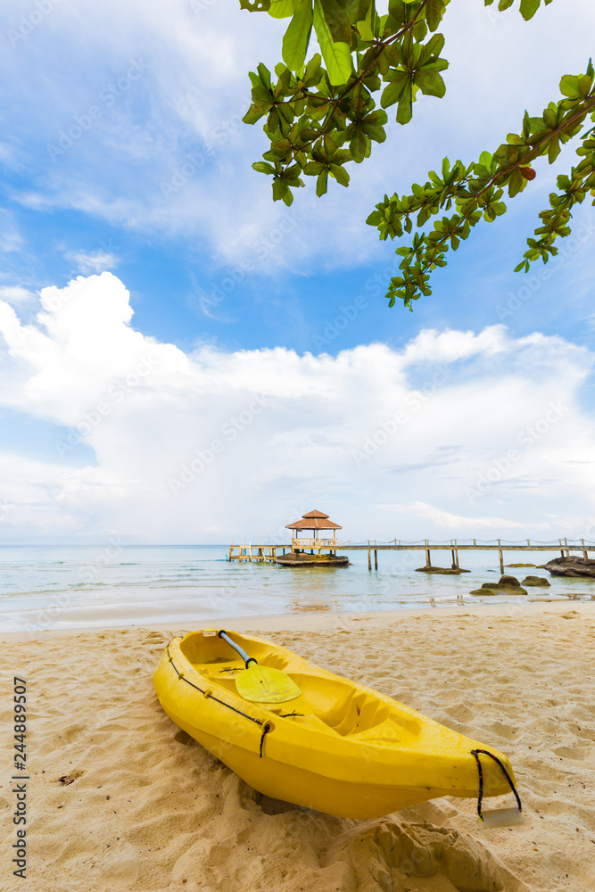 Yellow kayak boat on sea beach summer vacation concept Yellow kayak boat on sea beach summer vacation concept
