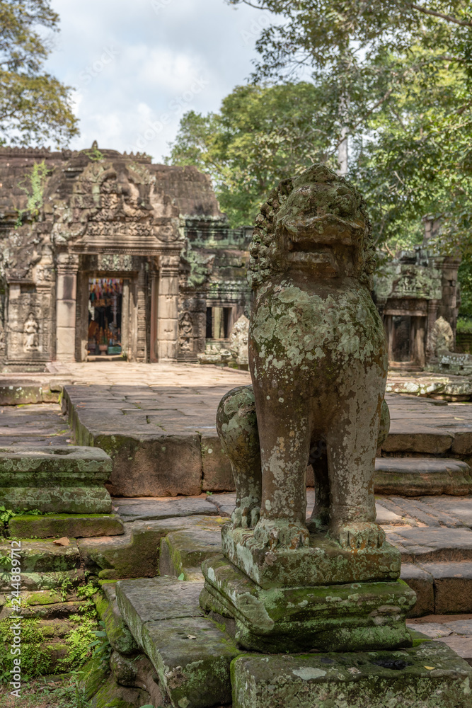 Stone lion guards entrance to Banteay Kdei