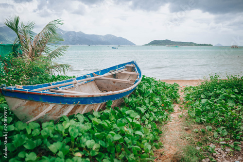 Bay, a village in Vietnam, with fishermen, boats on the background of the sea photo