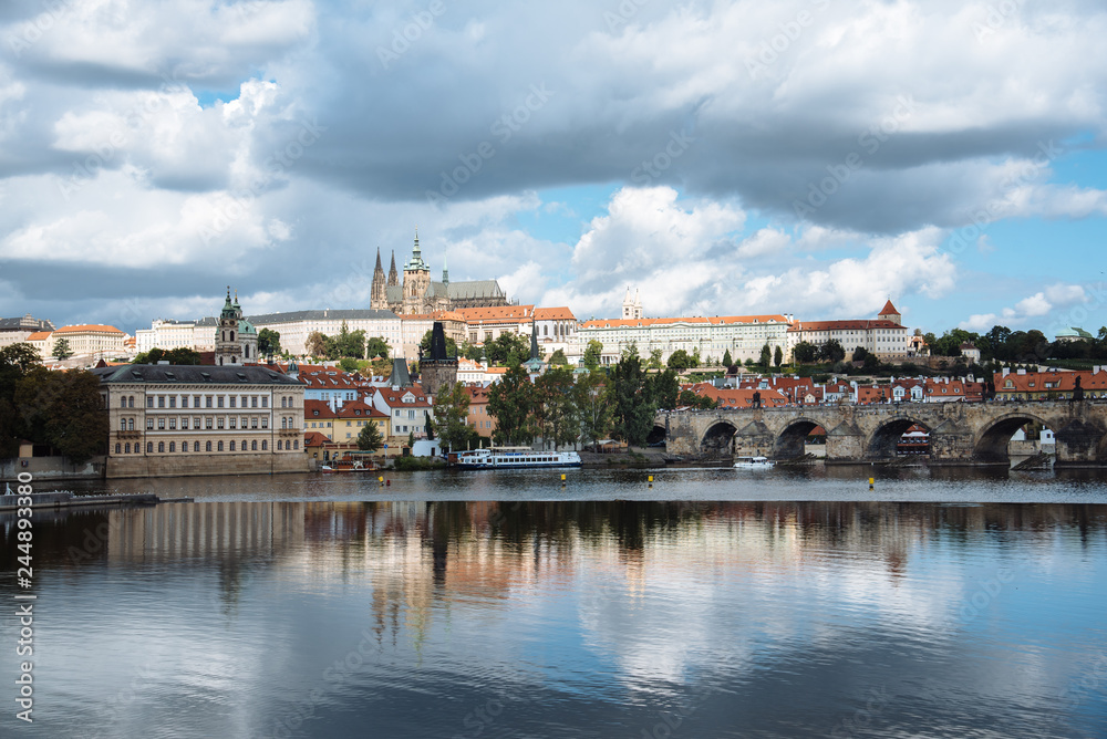 Cityscape of Prague and Vltava river with reflections