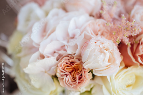 Wedding flowers  bridal bouquet closeup. Decoration made of roses  peonies and decorative plants  close-up  selective focus  nobody  objects