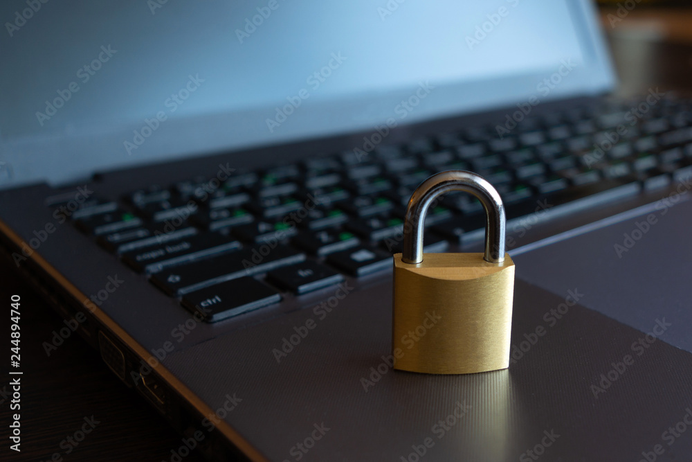 cyber safety concept, lock on laptop computer cyber safety concept, lock on laptop computer